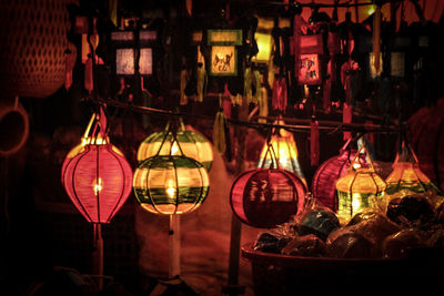 Illuminated lanterns hanging at night