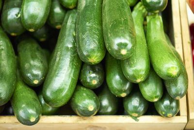 High angle view of zucchini for sale at market stall
