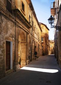 Street amidst buildings in pitigliano town, in tuscany