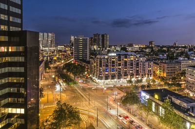 High angle view of illuminated city buildings at night