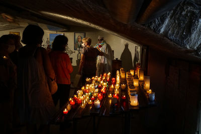 Rear view of people at illuminated temple