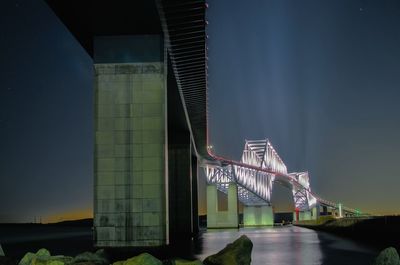 Illuminated bridge at night
