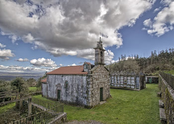 Traditional windmill against sky