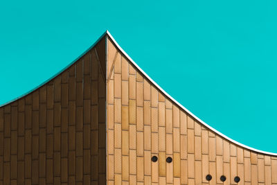 Low angle view of building against clear blue sky