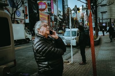 Full length of man on street in city