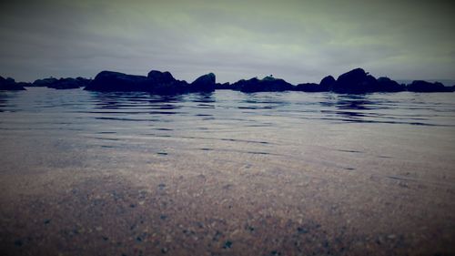 Scenic view of sea against sky at dusk