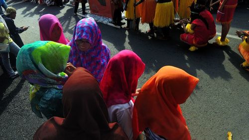 Low section of people on multi colored outdoors