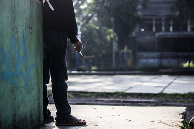 Side view of man smoking cigarette