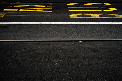 High angle view of arrow sign on road