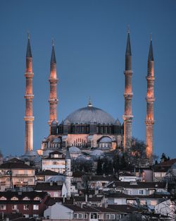 Mosque against clear sky at dusk