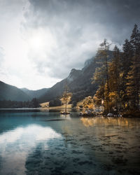 Scenic view of lake and mountains against sky