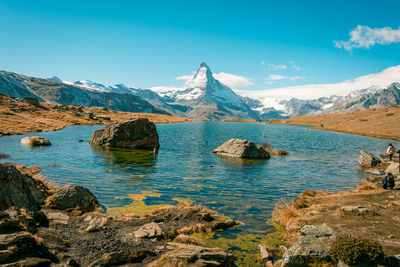 Scenic view of snowcapped mountains against sky