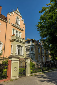 Low angle view of building against blue sky