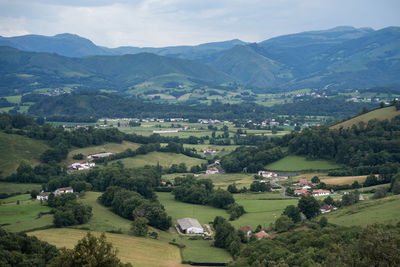 High angle view of townscape and mountains against sky