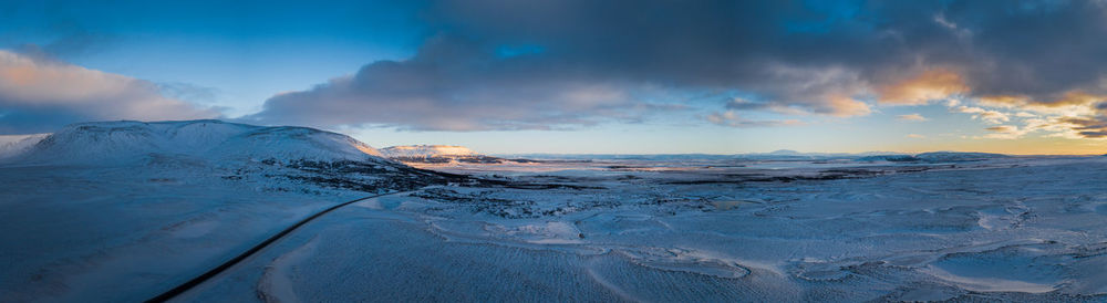 Scenic view of frozen sea against sky during sunset