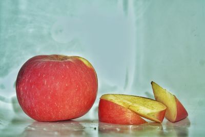 Close-up of apples in container on table