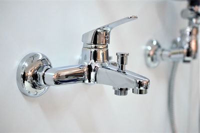 Close-up of faucet in bathroom