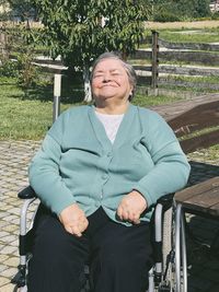 Portrait of senior women sitting on invalid wheelchair