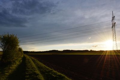 Scenic view of field against sky during sunset