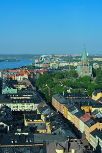 High angle view of townscape against blue sky