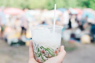 Close-up of hand holding drink