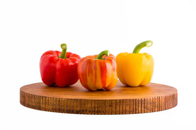 Close-up of bell peppers against white background