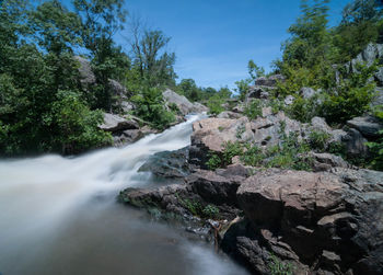 River flowing through rocks in forest