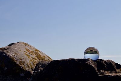 Low angle view of rock formation against clear sky