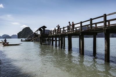 Pier over sea against sky