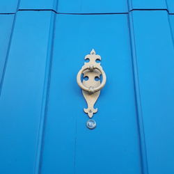 Close-up of door knocker on wall