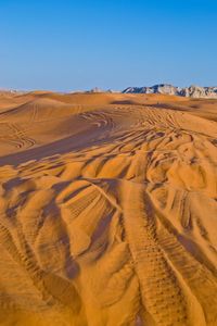 Scenic view of desert against clear sky