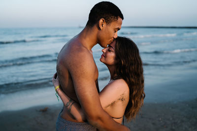 Beautiful young couple on beach