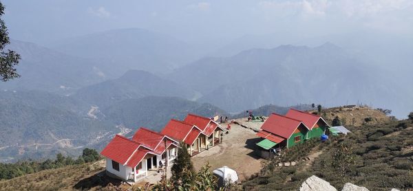 High angle view of houses and mountains against sky