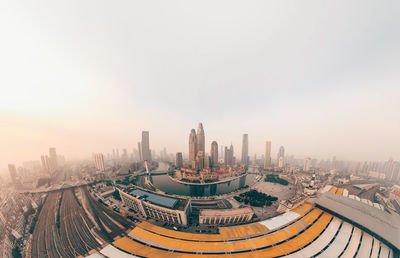 High angle view of buildings in city against sky