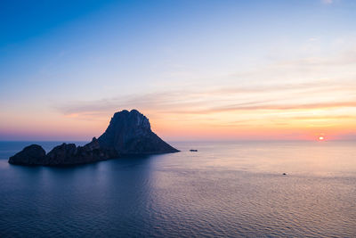 Ibiza, spain august 31 2019, sunset over sea from ibiza with es vedrà island