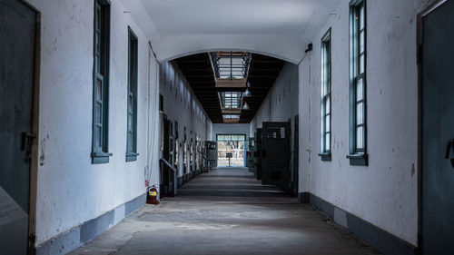 Empty alley amidst buildings