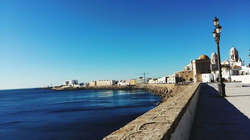 Sea against clear blue sky