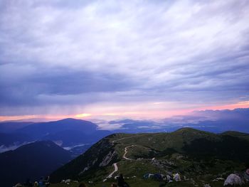 Scenic view of mountains against dramatic sky