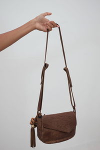 Person holding umbrella against white background