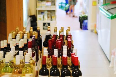 Close-up of bottles on table at store