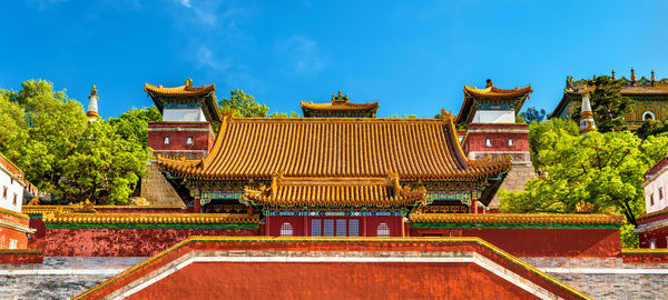 Low angle view of temple against blue sky
