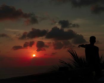Silhouette of people at sunset