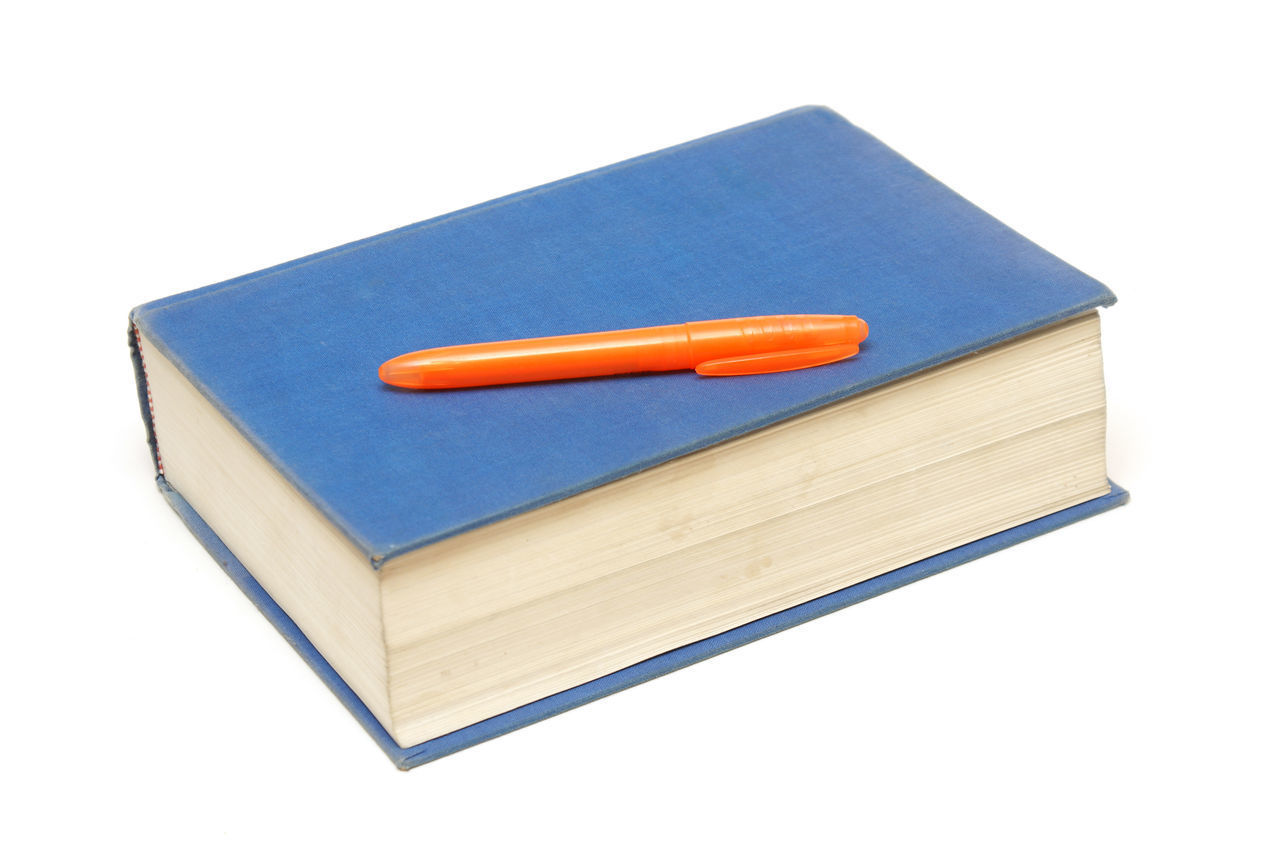 HIGH ANGLE VIEW OF BOOKS AGAINST BLUE BACKGROUND