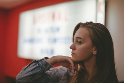 Close-up of young woman at home