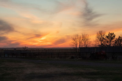 Scenic view of field against sky during sunset