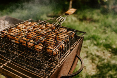 Close-up of meat on barbecue grill