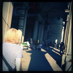 Woman standing against wall