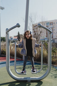 Portrait of a four-year-old girl in a daytime park with a jacket