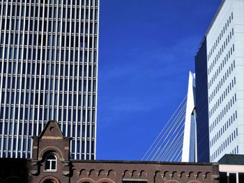 Low angle view of building against blue sky