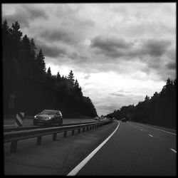 View of road against cloudy sky